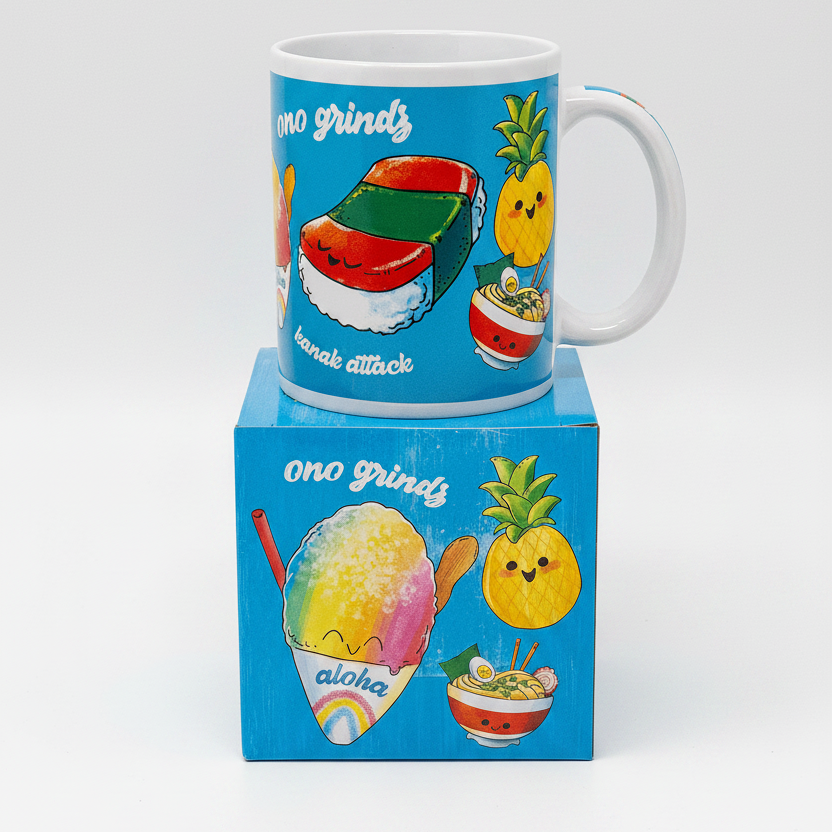 Mug with cartoon food illustrations on a matching box, featuring the brand 'ono grindz'.