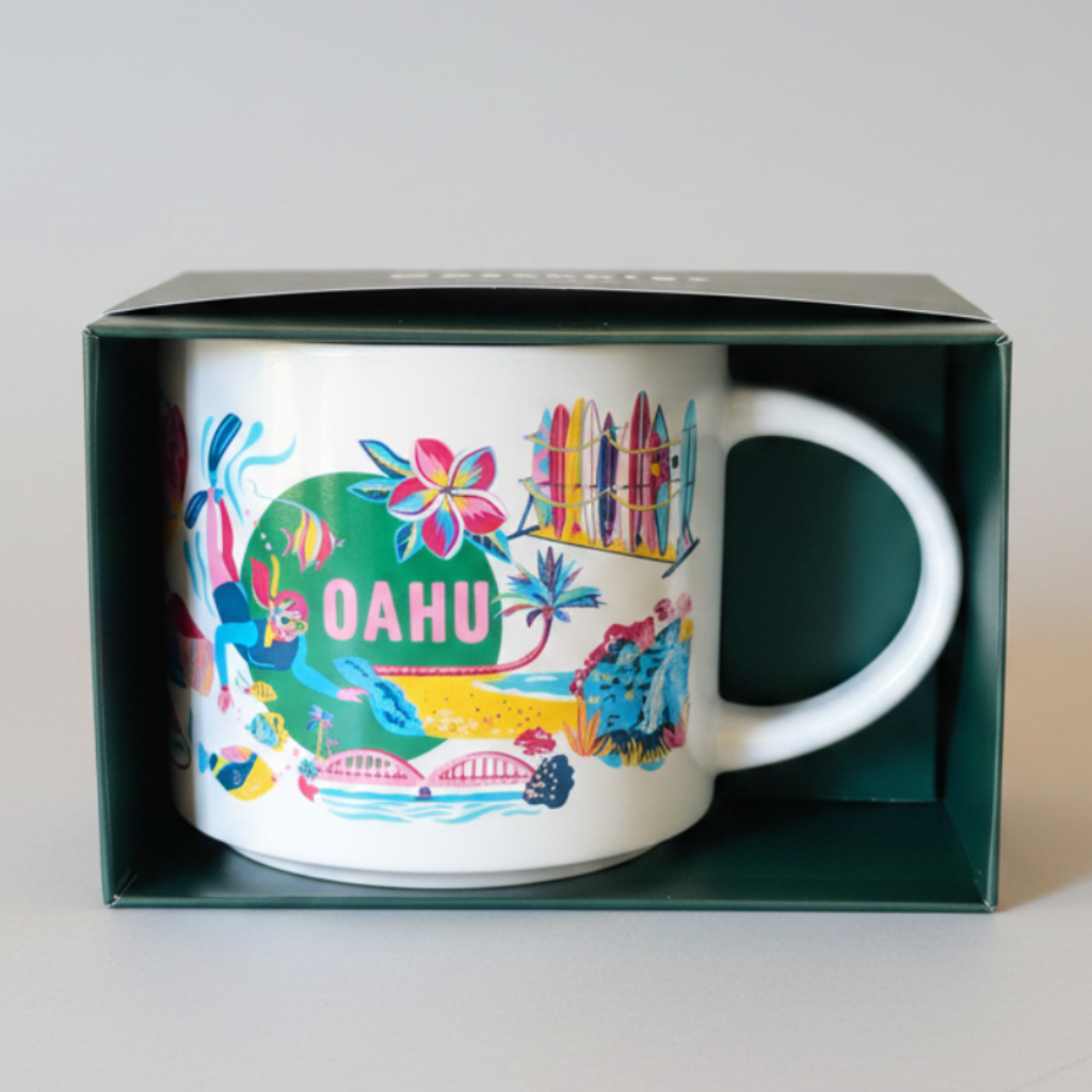 Colorful mug with 'Oahu' design in a green box