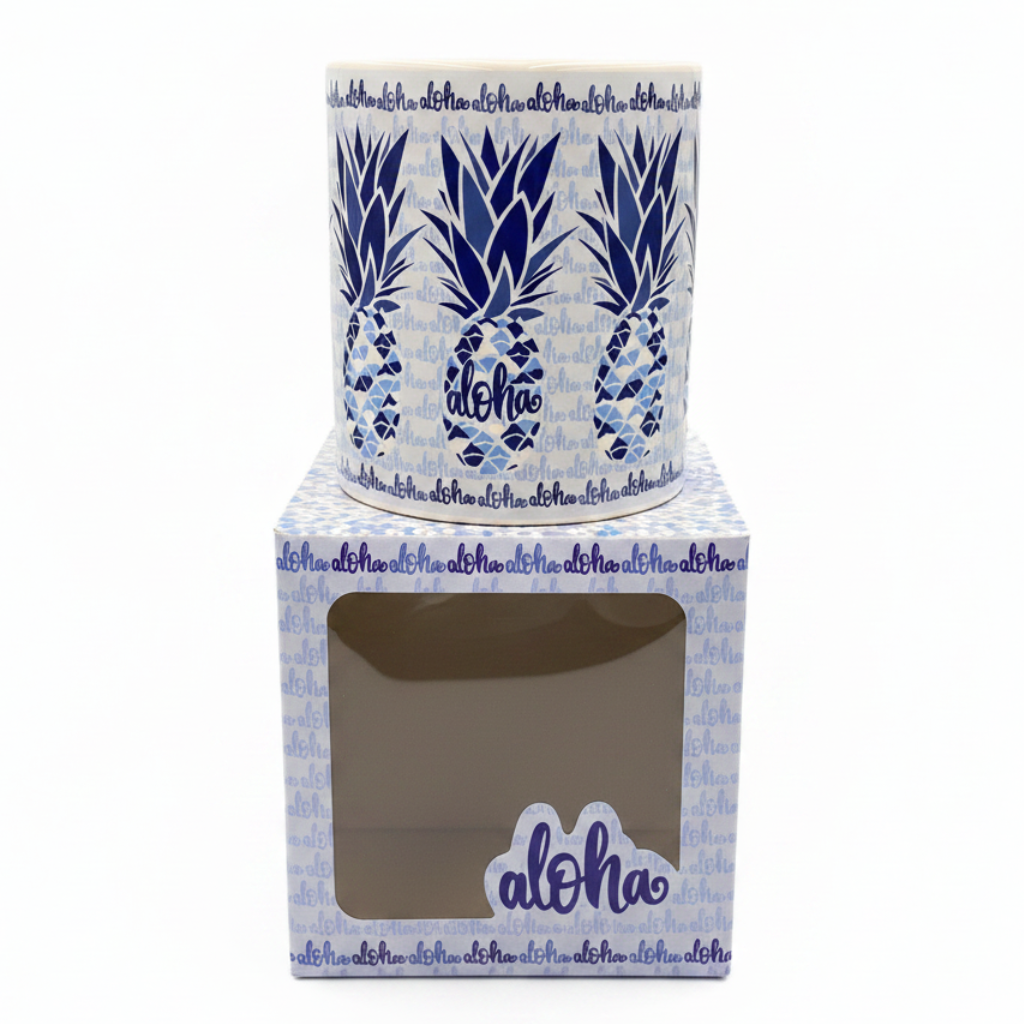 Ceramic planter with blue pineapple design and 'aloha' text, displayed in a matching box.
