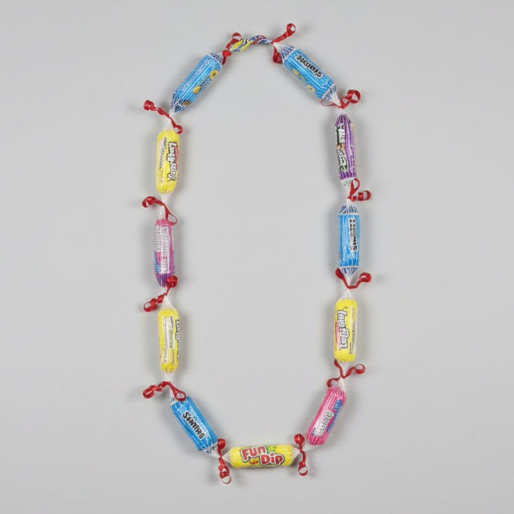 Necklace made from candy wrappers on a wooden surface