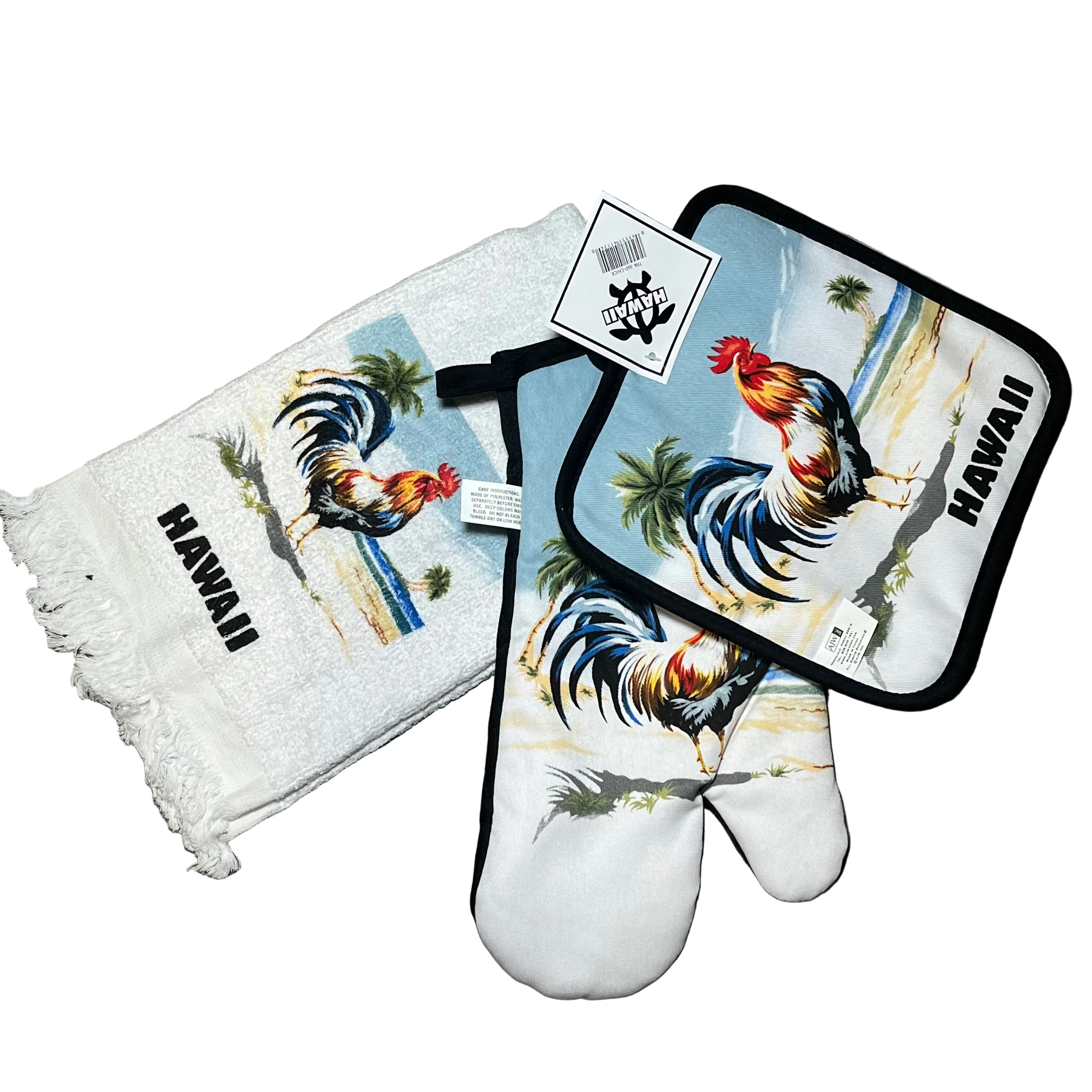 Set of rooster-themed kitchen items including a towel, pot holder, and oven mitt on a wooden surface.