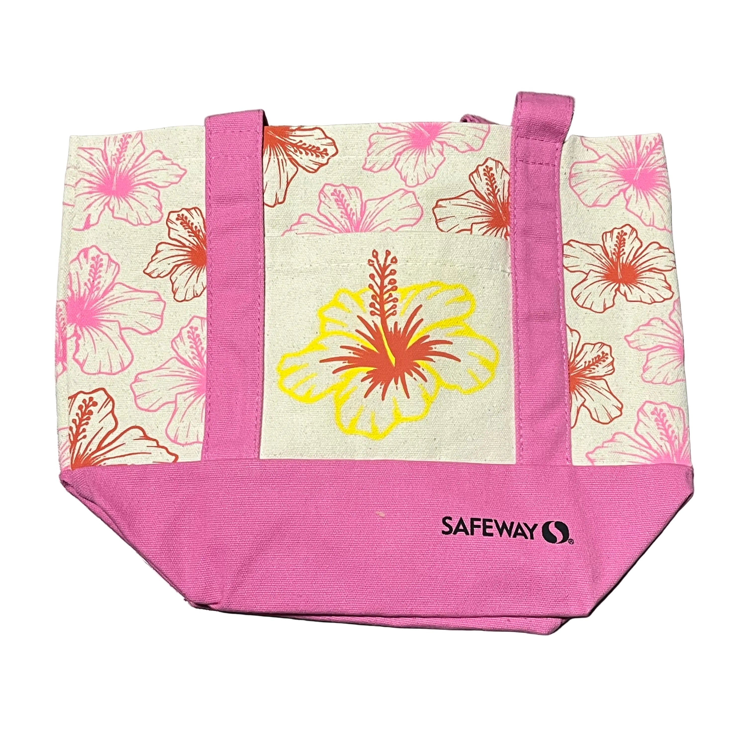 Floral tote bag with pink accents and Safeway logo on a gray surface